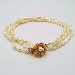 🩷TRIPPLE STRAND  PEARL BRAIDED BRACELET WITH FLORAL PENDENT